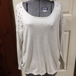 Sweater with embellishments on shoulders